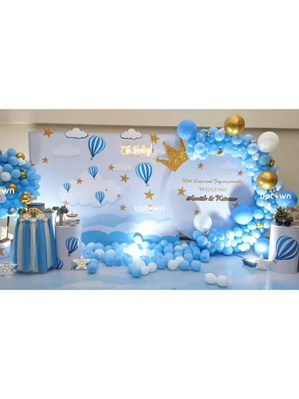 A wide shot of the blue and white welcome baby decor.