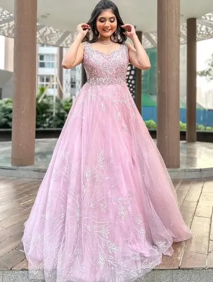 Feel like a princess in this beautiful pink ball gown, perfect for an engagement, pre-wedding shoot, or reception. The full tulle skirt and embellished bodice create a true fairytale look.