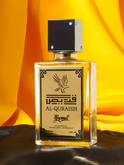 A luxurious shot of an Arabic perfume against a backdrop of black and gold silk. The rich colors and textures perfectly complement the bottle's design, creating a high end feel.
