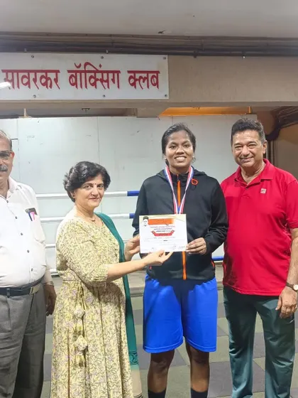 Another one of our gold medalists being awarded for her excellent performance in the ring.