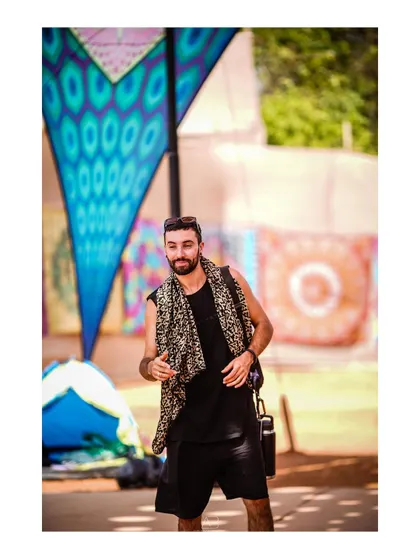 A stylish festival-goer, captured in a candid moment. This shot is as much a fashion portrait as it is a documentary of the event.