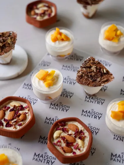A selection of my individual desserts, perfect for a flying buffet at a Diwali party. This image shows Mango Mousse, Tiramisu, and Phirni, offering something for every sweet tooth.