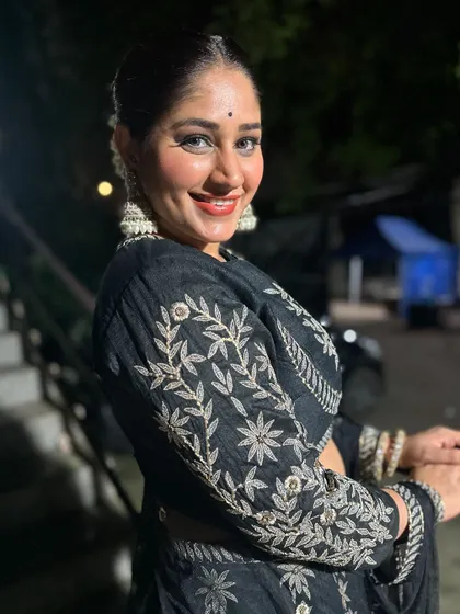 Donam Bajwa looking radiant and festive. This shot captures the joy of celebrating in a beautiful outfit that you don't have to buy.