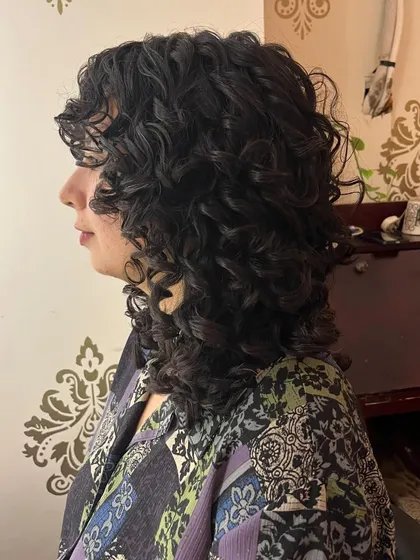 A side view of the curly shag, highlighting its modern, textured shape.