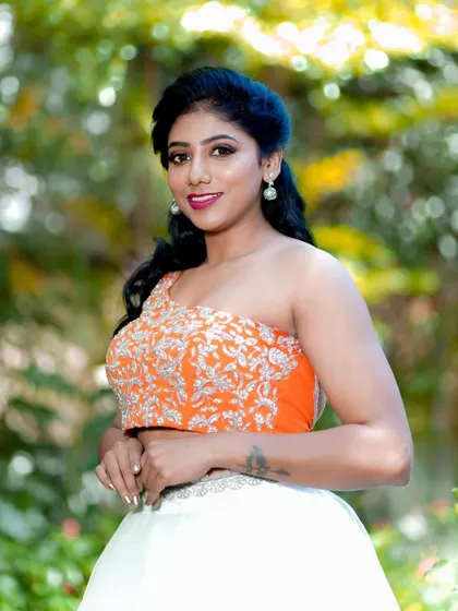 A bright and happy portrait. The makeup is fresh and radiant, designed to look perfect in outdoor settings and capture the client's joyful personality.