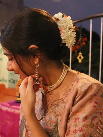 A close-up shot from my devotional music video. The traditional attire and flowers are part of creating an authentic and sacred visual and auditory experience.