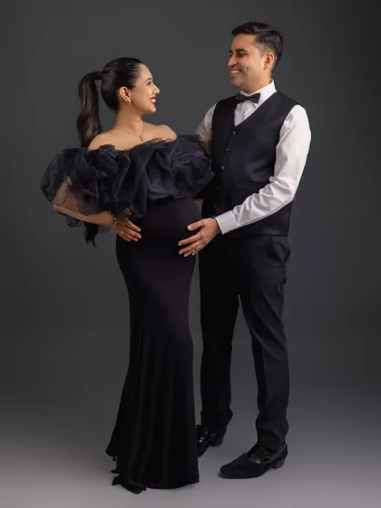 A formal and elegant couple's portrait. The black-tie attire contrasts beautifully, creating a sophisticated and timeless image.