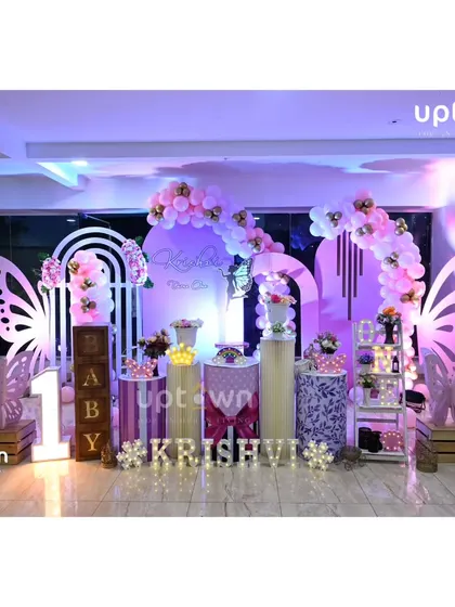 A wide shot of the butterfly theme, capturing the elegant lighting and decor elements.