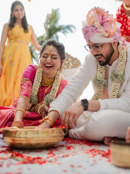 A vibrant varmaala ceremony with colorful smoke, creating a truly spectacular and modern moment. We love capturing both the tradition and the unique personality of your wedding.