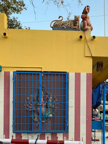 The vibrant colors and bold forms of a small neighborhood shrine. These elements of folk art and local expression contribute to the unique character and identity of a place.
