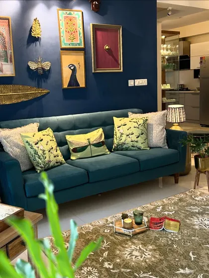A close-up of the summer-ready sofa. The dragonfly-themed cushions add a touch of whimsy and nature to the decor.