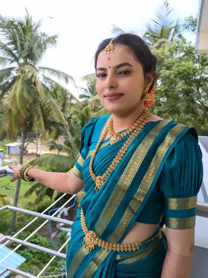 A simple and elegant engagement look for Yashaswini. The makeup is minimal and fresh, perfect for a daytime function, proving that you don't need heavy makeup to look stunning.