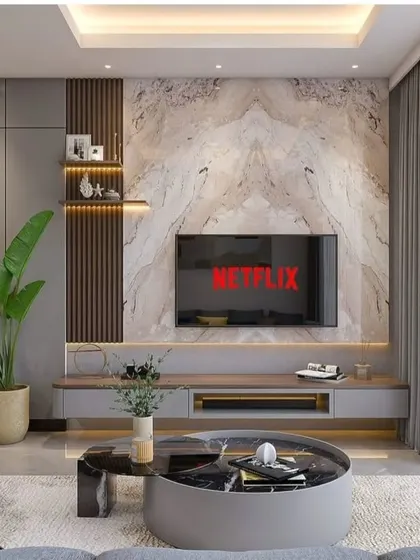 A close-up of a bespoke entertainment unit. This design combines a marble-finish back panel with wood fluting and a sleek grey console, demonstrating our ability to mix premium materials for a luxurious feel.