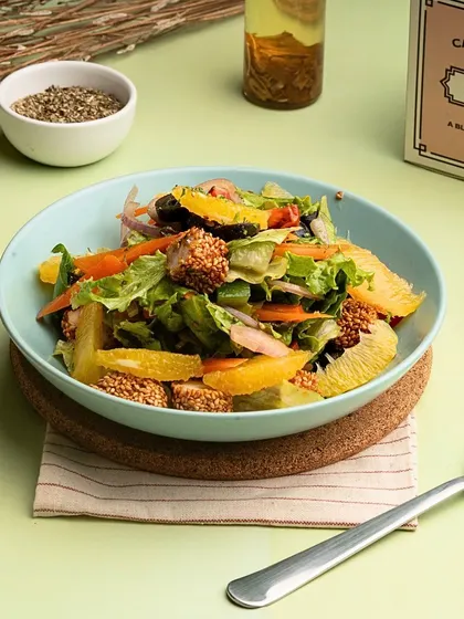 Another look at the Orange and Sesame Chicken Salad, highlighting the generous portion of sesame-coated chicken.