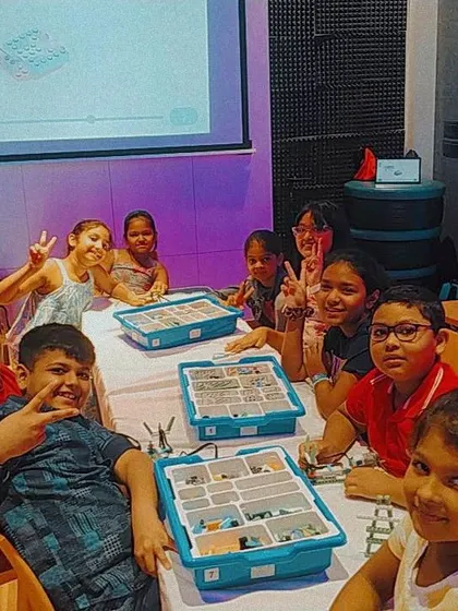 A group of proud students at our Blob Studio camp location in Kolkata, showing off their completed robots.