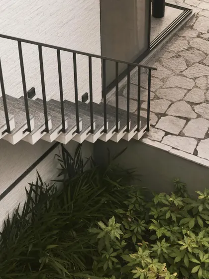 A detail of the staircase and flagstone patio at Pavilion House, showing the careful integration of different materials and levels.
