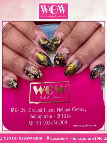 Another view of our celestial black and gold nail art. The combination of deep black, shimmering gold, and delicate star and moon patterns is truly enchanting.