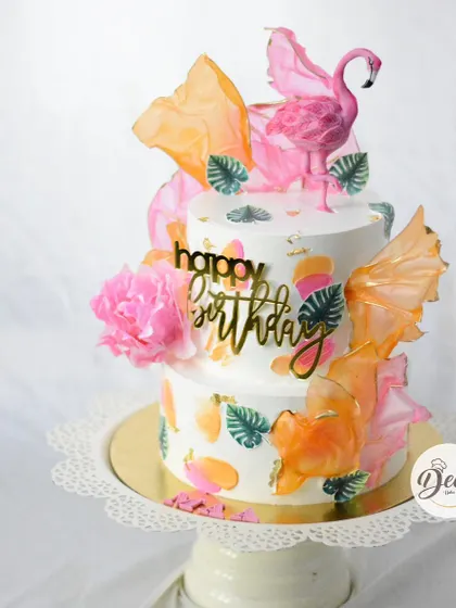 This angle shows the beautiful color combination and the dynamic arrangement of the wafer paper sails on the tropical cake.