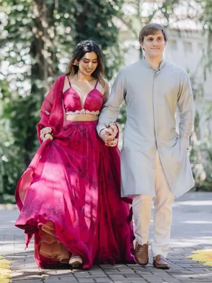 Celebrating love in the happiest hues. For her Haldi, we styled this bride in a vibrant pink Bhumika Sharma lehenga with beautiful floral jewelry.