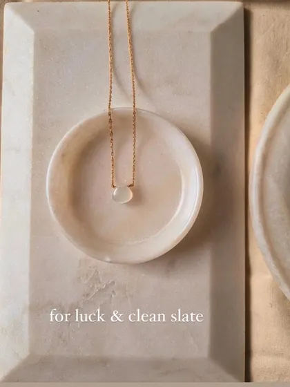 The White Moonstone heart drop pendant is for luck and a clean slate.