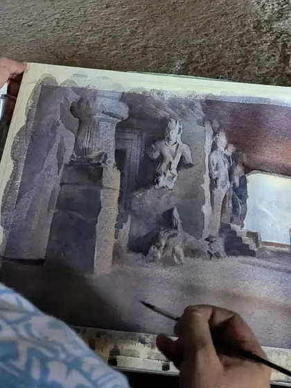 A close up of me working on the Elephanta Caves painting on location. Capturing the light and shadow accurately is key to giving the painting depth and realism.