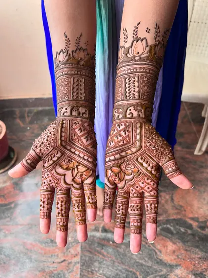 Another angle of the engagement mehendi, showing the intricate details on the palms and fingers.