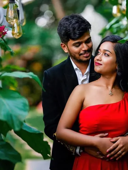 A sweet embrace captured amidst the greenery, highlighting the couple's connection.