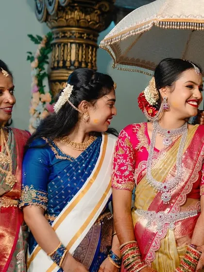 A bride sharing a laugh with her bridesmaids and family. We capture the important relationships and friendships on your wedding day.