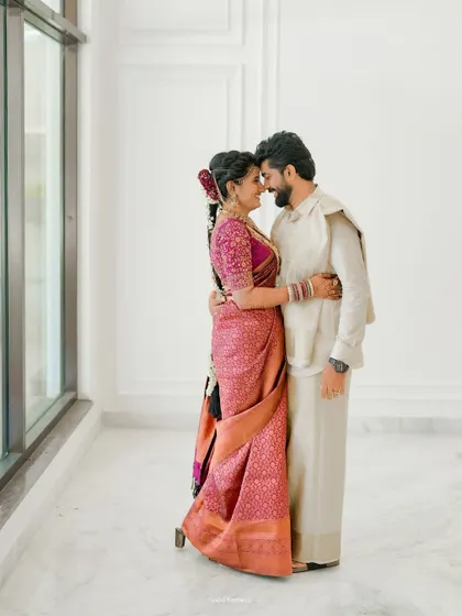 An intimate portrait of the couple in a minimalist white space, their connection being the main focus.