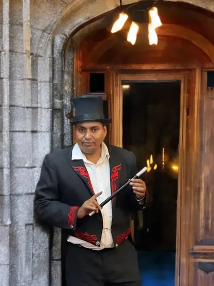 Dressed in my full magician attire with a flaming magic wand. This look is perfect for creating a classic, mysterious atmosphere for stage shows and themed events.