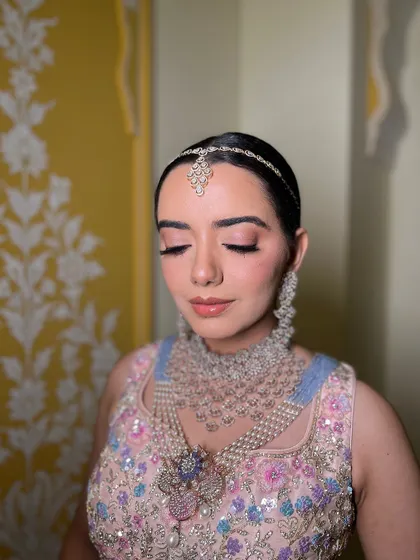 This is a bridal look I created for a TV commercial. The makeup is soft and neutral, with a focus on pink tones to match the pastel outfit.