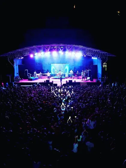 A packed house for a live concert. I managed the entire production, including the large domed stage truss, a powerful sound system to cover the entire ground, and a light show that energized thousands of fans.
