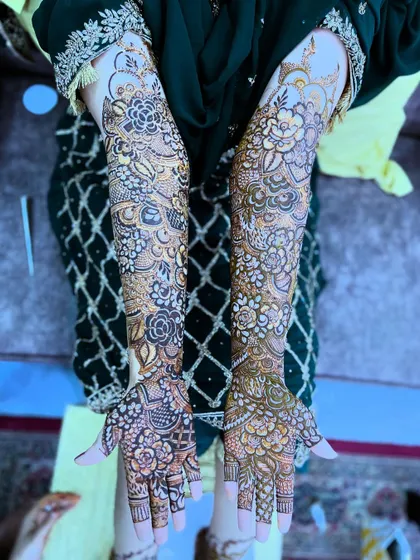 A full view of the bridal henna for the beautiful Saima, showcasing the intricate floral patterns.