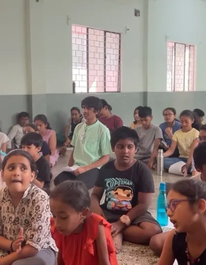 The children are fully engaged during a group singing activity. My classes focus on listening and participation, creating a collective learning experience.