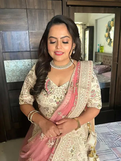 A close-up with eyes closed, this shot shows the soft, blended eyeshadow and the beautiful dewy finish on the skin. It's a perfect look for a romantic engagement party.