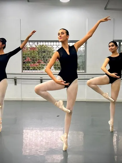 Three of our dancers en pointe, demonstrating their skill and artistry during a studio session.