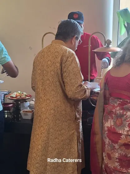 Guests enjoying the buffet at a naming ceremony. My team is trained to be polite and efficient, ensuring the food line moves smoothly and everyone is served well.