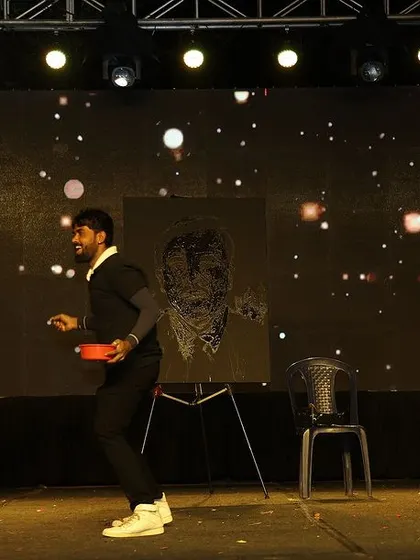 The moment before the reveal. I enjoy interacting with the audience and building a sense of excitement before I show them the finished artwork.