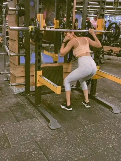 A photo from my online coaching announcement, highlighting my focus on strength training with exercises like the back squat.