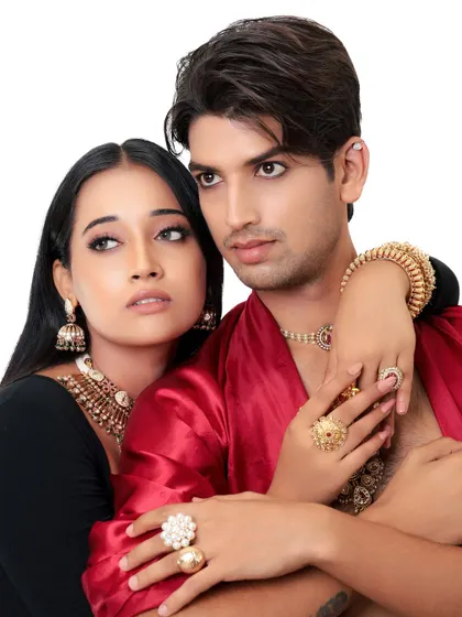 A royal couple's portrait. This shot captures the chemistry between the models, both adorned in stunning traditional jewelry and attire.