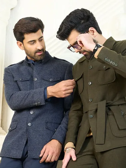 A moment of interaction between two models wearing my co-ord sets. The image highlights the fine tailoring and details of both the navy and olive green ensembles.