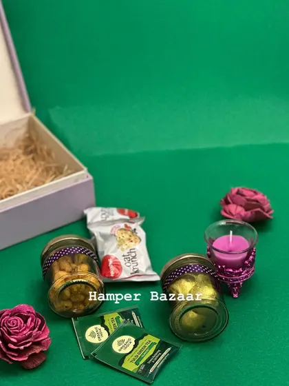 Here are all the contents of our corporate wellness hamper, unboxed. We select each item, like the green tea and oat cookies, to create a cohesive and thoughtful gift.