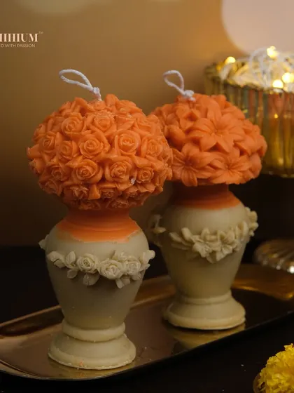 The same flower vase pillar candle design, here in a warm orange and cream color combination. These are perfect for festive occasions like Diwali.