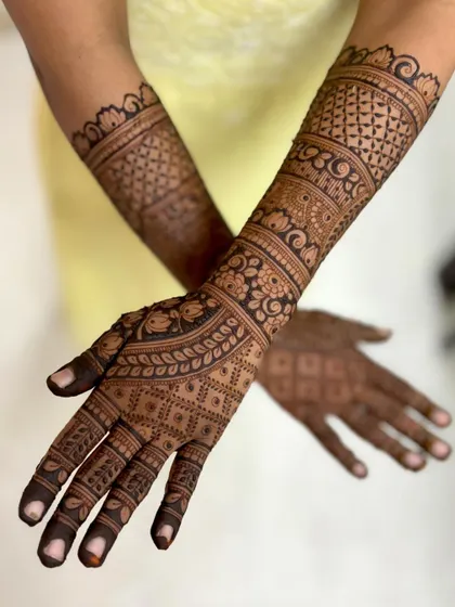 An angled shot showcasing the flow of the intricate bridal patterns.