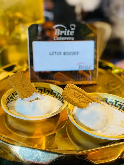 A clear shot of the Lotus Biscoff ice cream, served in small bowls with a biscuit.