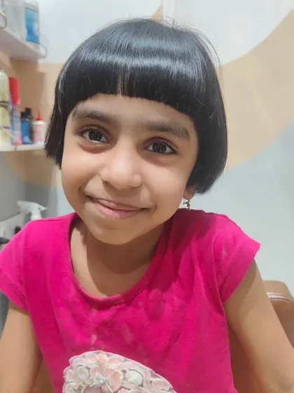 A super cute and chic bob with a full fringe for this little girl.