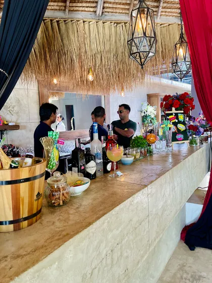 My services are not just about modern setups. For this event, I designed a rustic, bohemian-style bar with natural wood, thatch, and warm lighting to create a relaxed and stylish vibe.