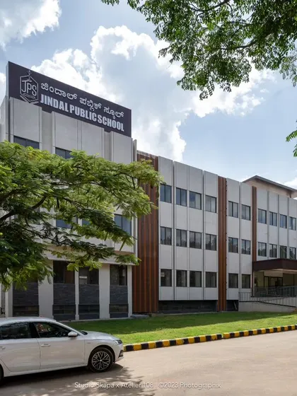 Another shot of the school's facade, showing how the vertical rafters add warmth and visual interest. The color palette was carefully chosen to feel timeless and withstand the dust from the adjacent highway.