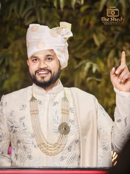A happy groom, Advocate Samar Yusuf, enjoying his wedding celebration. His smile and energetic pose capture the joy of the moment.