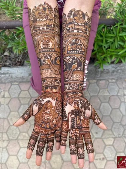 A beautiful depiction of a royal bride and groom in their wedding attire. The design is filled with traditional motifs like elephants, peacocks, and lotuses for a complete bridal look.